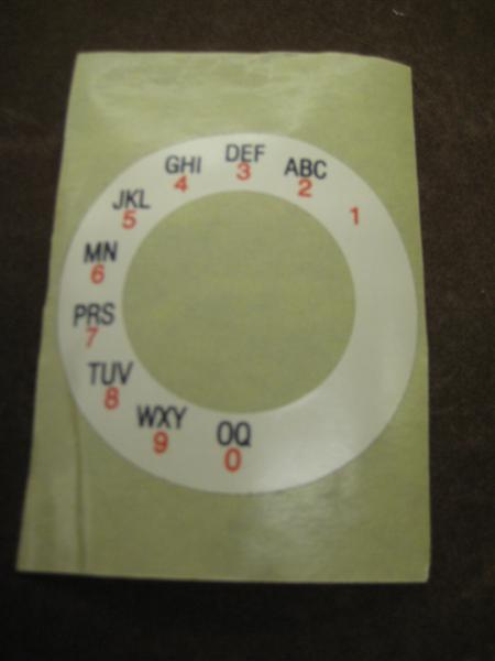 Alpha-numeric sticker for dials